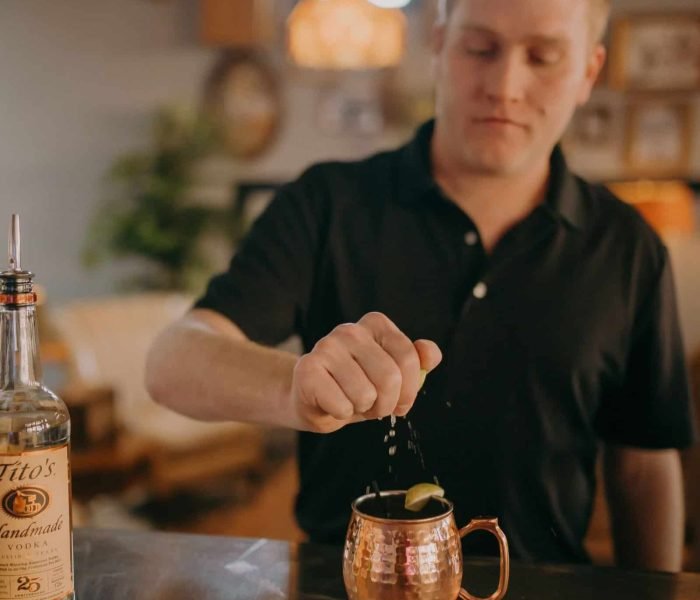 chic bartender making a drink